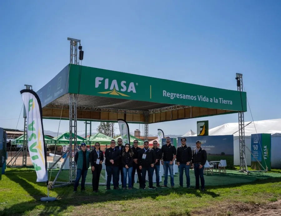 FIASA booth at an outdoor agricultural expo, "Bringing life back to the land"